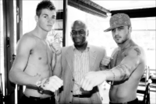 WARRIORS: Tommy Oosthuizen, left, Emperors Palace's Vusi Zwane and Jared Lovett at the fight announcement yesterday. 06/04/09. © Unknown.