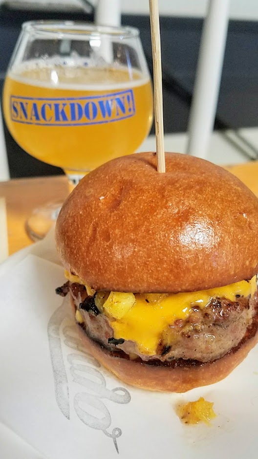 Snackdown 2018 pairing of Lardo/Pono brought together Smoked Pork Burger, American Cheese, Dirty Mustard, Grilled Pineapple with the Pono Brewing Pineapple Kölsch