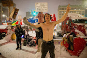 A man dances as protests against coronavirus disease (Covid-19) vaccine mandates continue, along Wellington street near the Parliament of Canada, in Ottawa, Ontario, Canada, February 17, 2022. 