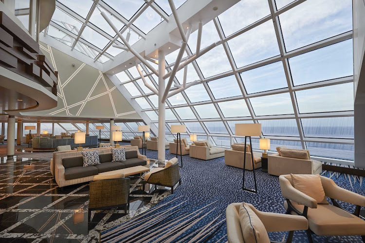 Enjoy the passing seascapes from the Haven Observation Lounge on Norwegian Joy.