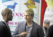 'Dog whisperer' James Lech, right, at his stall at a dog and cat show at Gallagher Estate in Sandton yesterday