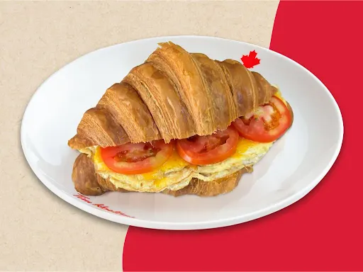 Egg, Cheese & Tomato Croissant Sandwich.