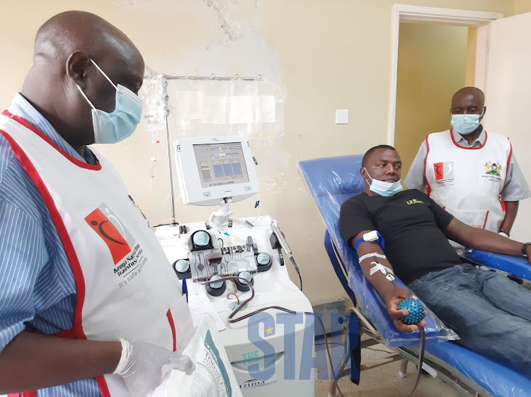 A man donating platelets at the Nakuru Health facility.