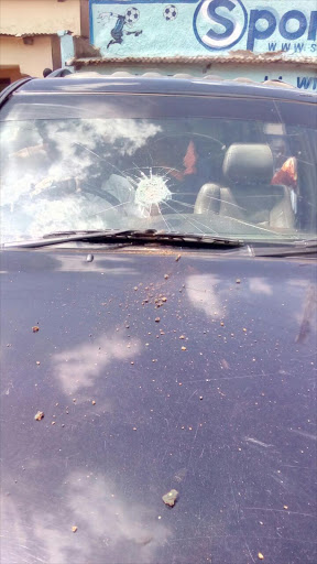 The shattered window of Cord leader Raila Odinga's vehicle following chaos in Shibale, Mumias, November 25, 2016. /SHABAN MAKOKHA