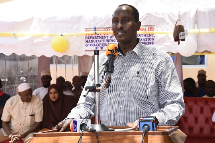 Wajir governor Mohamed Abdi Speaking in Wajir town on Monday during the handing over of business start-up equipment and tools to cooperative societies comprising of youth and women groups from the six sub counties.