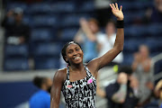 Coco Gauff of the United States waves to the crowd after winning a first round match against Magda Linette of Poland on day one of the 2021 U.S. Open.