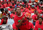 An EFF supporter holds a picture of party leader Julius Malema during the election manifesto launch at Moses Mabhida Stadium in Durban on Saturday.