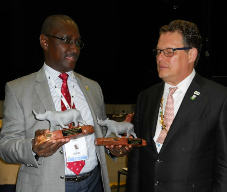 Brig. (Rtd) John Waweru accepting awards on behalf of The Late Ag. DG Julius Kimani & Julius Mwandai, (Rtd) Security who were selected to receive the Clark Bavin Wildlife Law Enforcement Awards on the sidelines of the ongoing CITES #CoP18 in Geneva, Switzerland