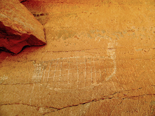 Unique incised and abraded bighorn sheep glyph