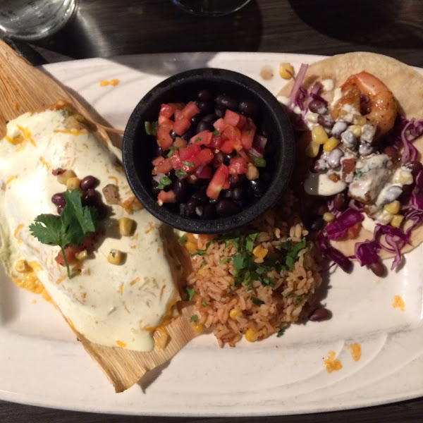 Corn tamale, shrimp tacos, rice and black beans.