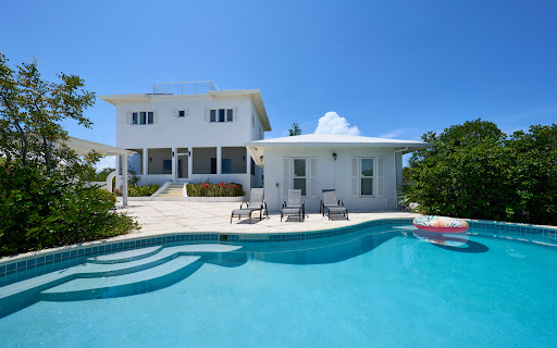 Luxury house for sale in Long Bay Hills (Turks and Caicos Islands) - White villa with pool and terrace