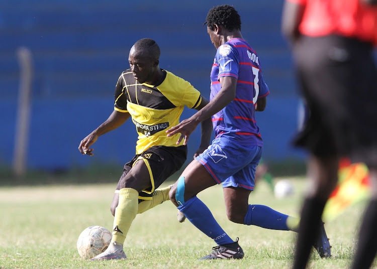 Dennis Oalo tries to stop Collins Omondi of Nairobi Stima in a past match.