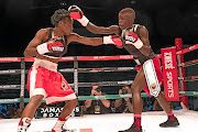 Smangele Hadebe, left,  exchanges the leather with Ellen 'Tigress' Simwaka during  the Africa Rising boxing event at the Portuguese Hall in May. /Gallo Images / Dan Edwards