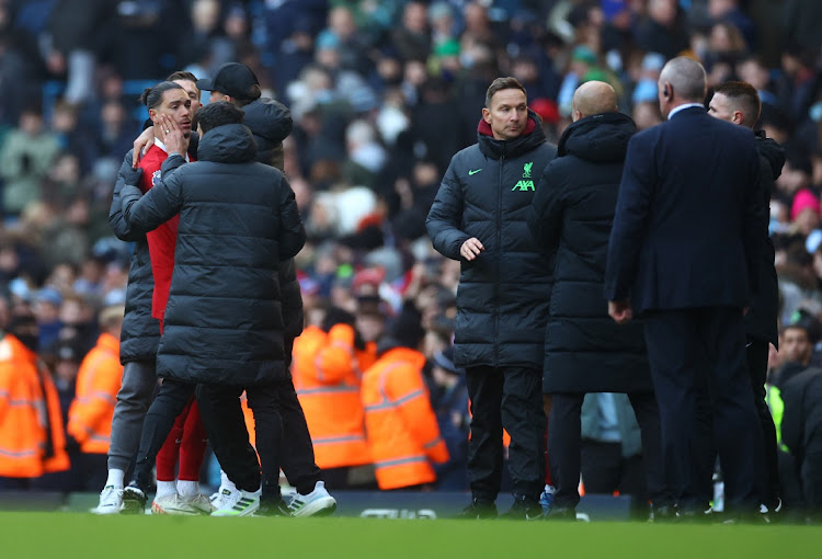 Manchester City manager Pep Guardiola clashes with Liverpool's Darwin Nunez as manager Juergen Klopp and assistant manager Pepijn Lijnders intervene