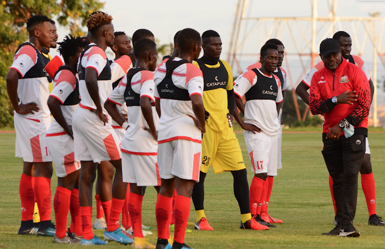 Harambee Stars' coach Jacob Mulee talks to players during a past training session at Moi Stadium, Kasarani