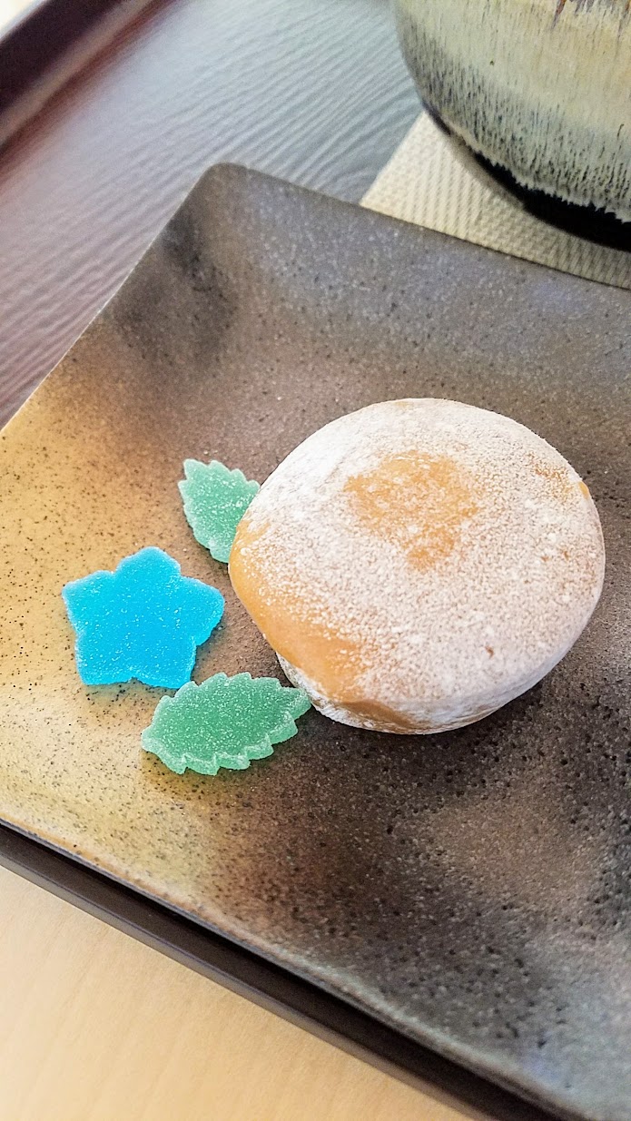 Visiting the Portland Japanese Garden Umami Cafe offering Japanese teas and snacks, Matcha with Mochi Ice Cream Set with a bowl of hand whisked matcha paired with premium chocolate ice cream wrapped in sweet rice dough