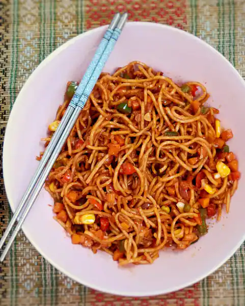 Veg Exotic Triple Schezwan Noodles