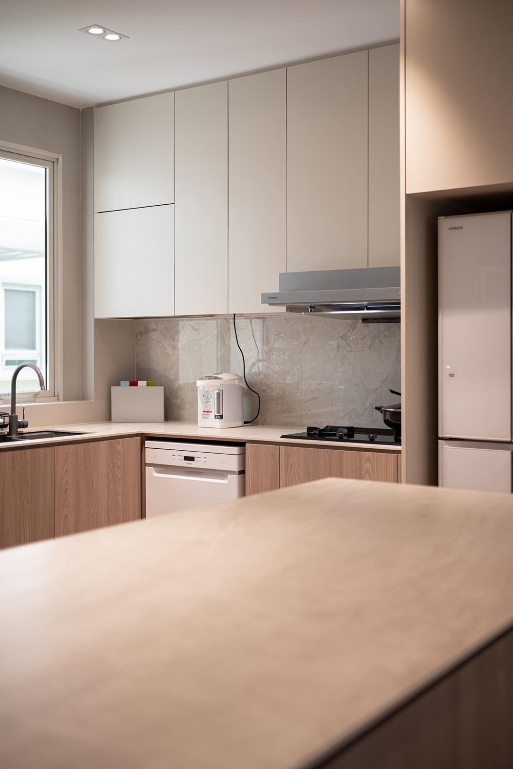 A kitchen with white cabinets and a countertop

Description automatically generated