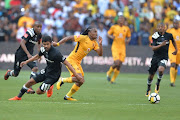 Abbubaker Mobara of Orlando Pirates and Siphiwe Tshabalala of Kaizer Chiefs and Orlando Pirates during the Absa Premiership match between Kaizer Chiefs and Orlando Pirates at FNB Stadium on October 21, 2017 in Johannesburg.