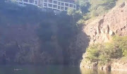 A paramedic from IPSS Medical Rescue swam across the quarry to the man‚ and managed to guide him down from the ledge and into the water.