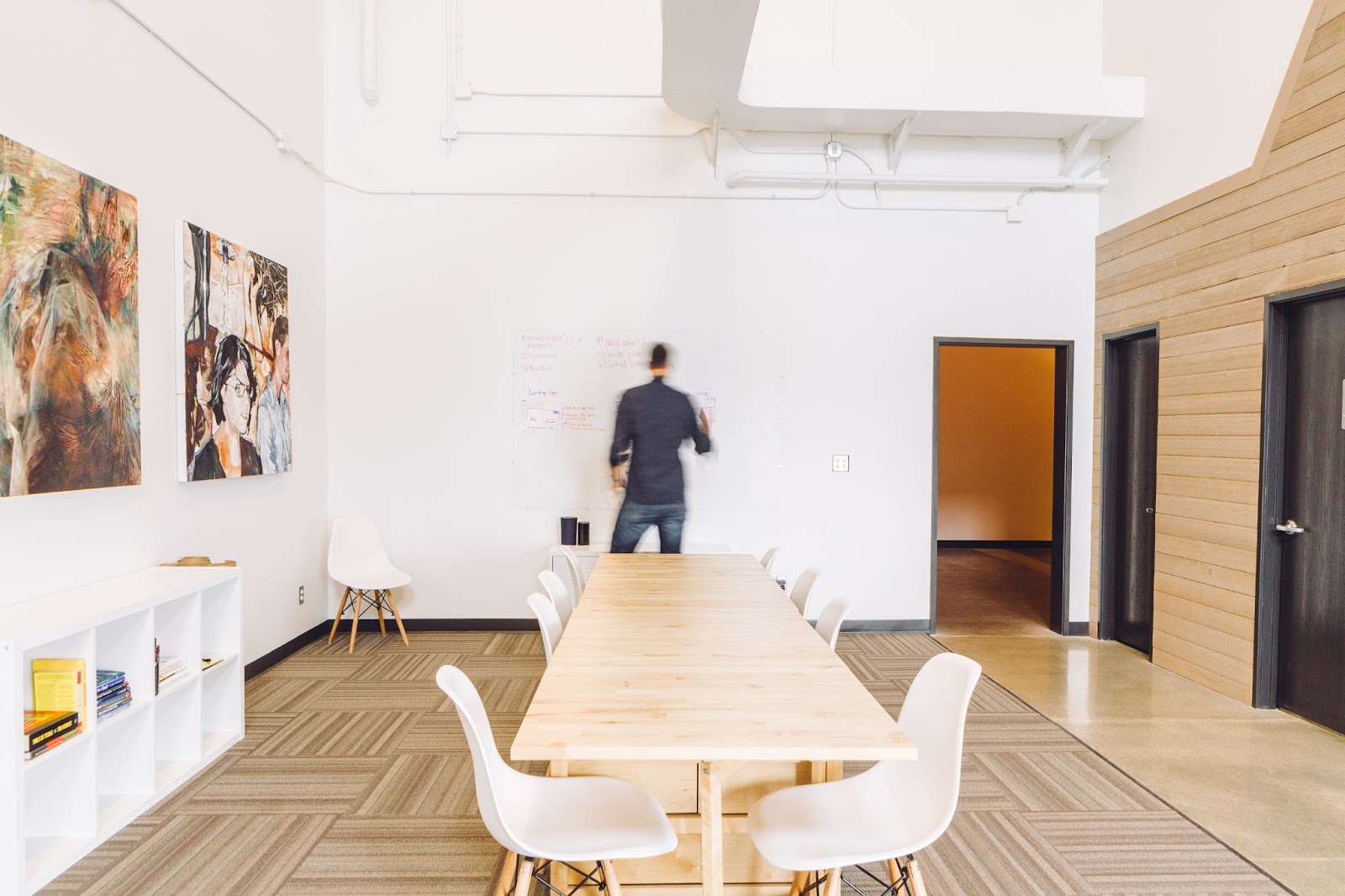 unique meeting space with whiteboard and artwork