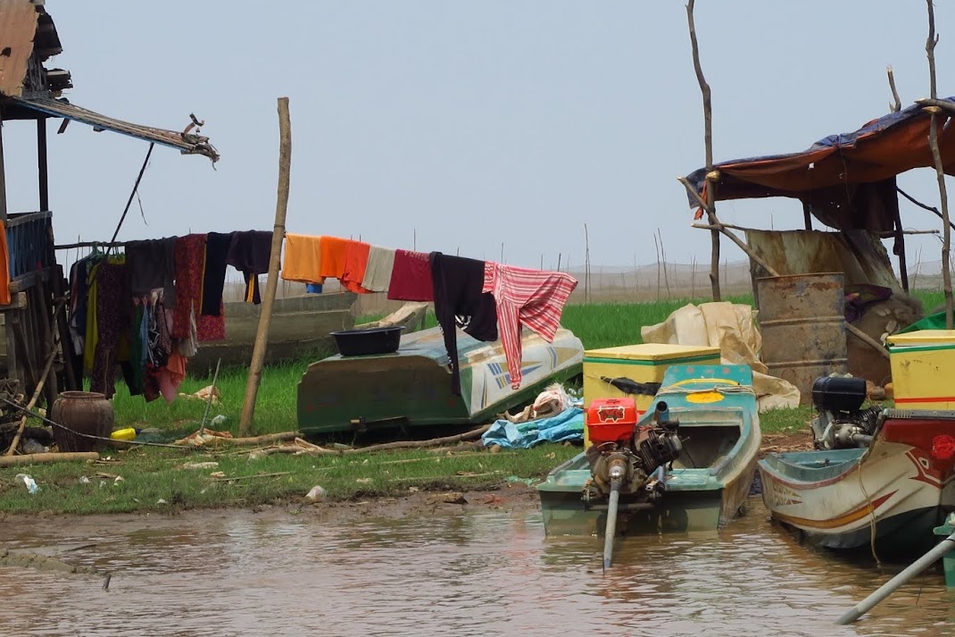 Laundry drying in the sun. I wonder if these clothes were washed in the muddy river.