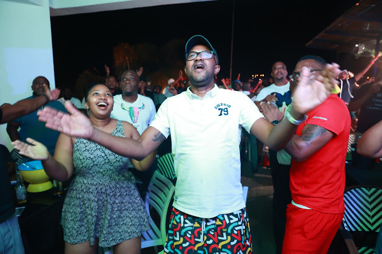 Fans watching Bafana Bafana and Nigeria at Disoufeng Pub Meadowlands Zone 10, Soweto.