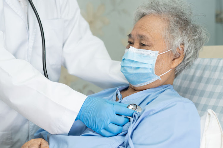 An elderly Covid-19 patient is monitored in hospital.