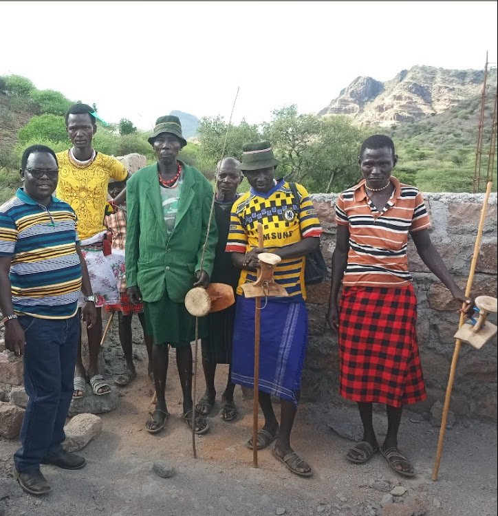 Tirioko ward MCA Sam Lokales with reformed Pokot warriors in remote Kong’or village in Tiaty, Baringo count.y on Tuesday, November 3.