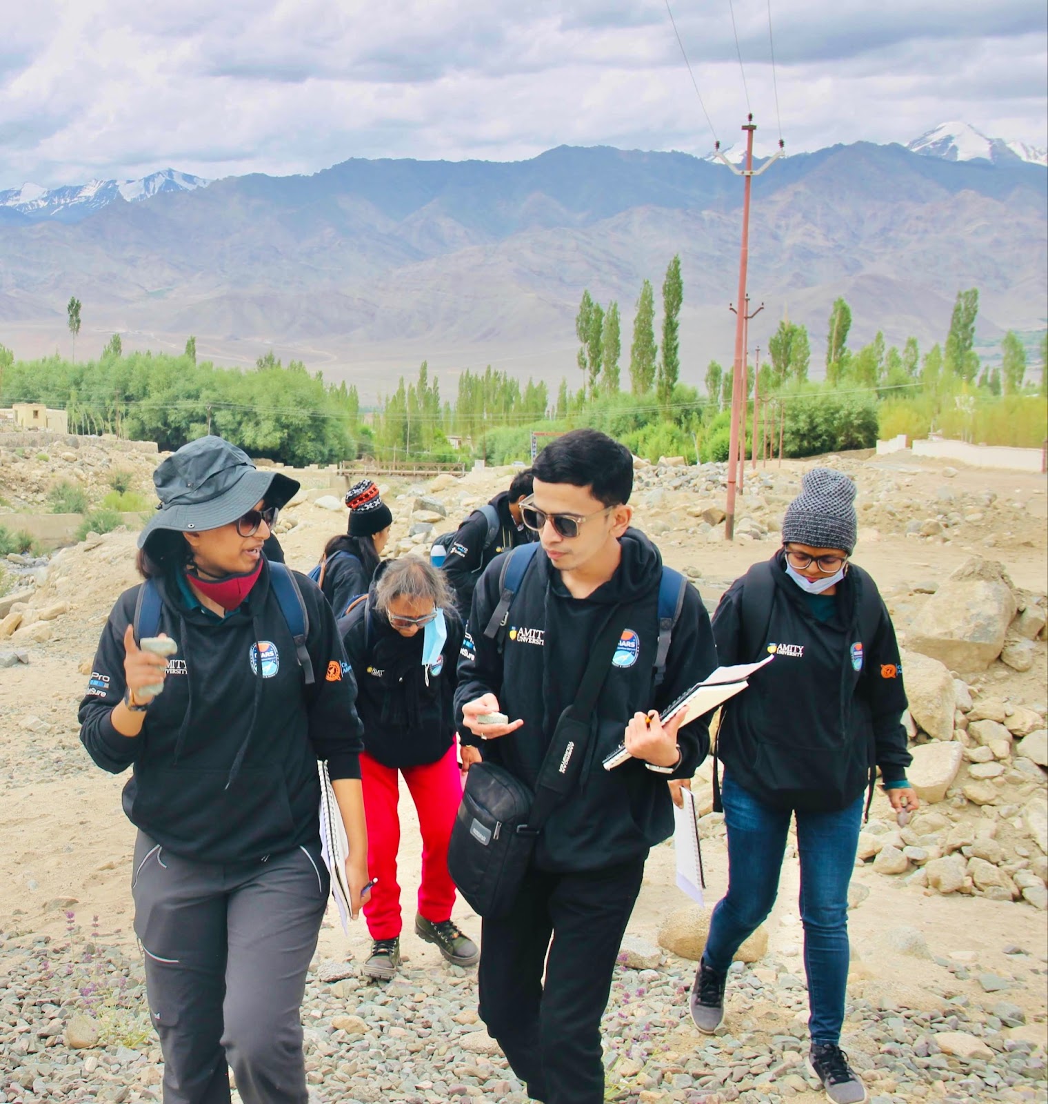 Patil and his colleagues climbing the Trans-Himalayas, discussing the rock formations and sediment remains following the Flash Flood Stream caused by the 2023 Cloud Burst Incident at Saboo Village near Leh City, Ladakh.