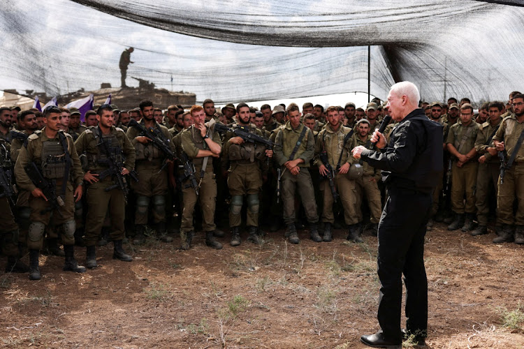 Israel's defence minister Yoav Gallant meets soldiers in a field near Israel's border with the Gaza Strip in southern Israel on October 19 2023. Israel has amassed tanks and troops near the fenced border around Gaza for a planned ground invasion aiming to annihilate Hamas. File photo.