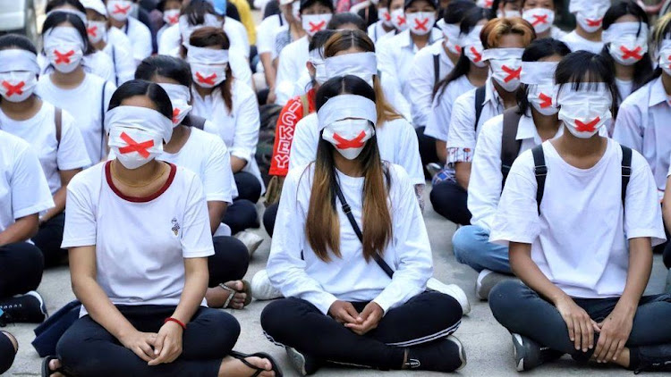 Protesters held a "silent strike" in Yangon after a seven year old was shot dead in Mandalay