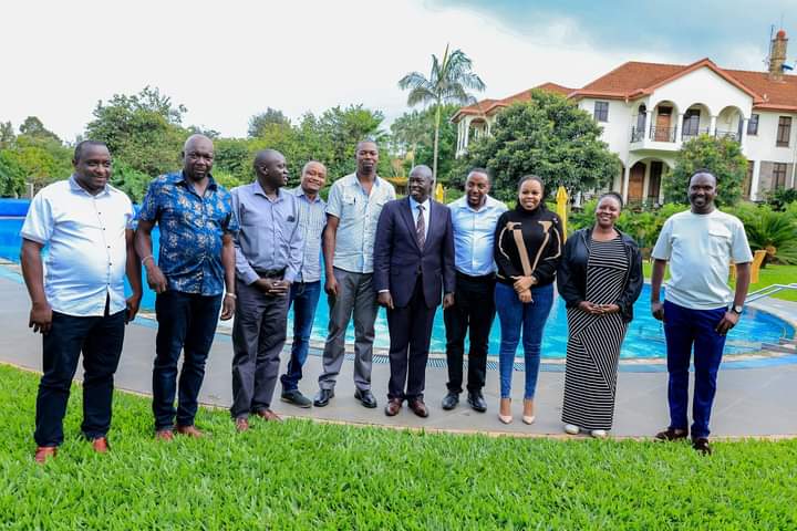 Deputy President Rigathi Gachagua shares a picture with mechanics from Kariokor after a meeting at his official Karen Residence on Wednesday, April 24, 2024