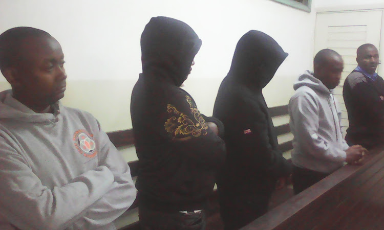 Four administration officers convicted of poaching listen to their sentencing in court yesterday