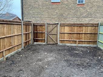 New feather edge fence with concrete posts and gravel boards  album cover