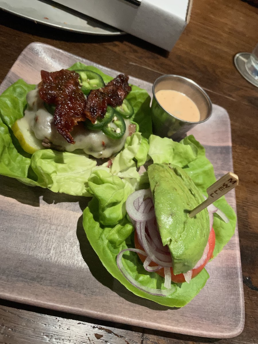 Jalapeño bacon burger in lettuce wrap.