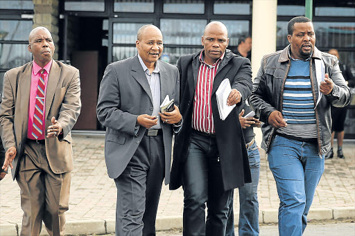 BREAD AND BUTTER ISSUES: Mayor Alfred Mtsi, second from left, speaking to city manager Andile Fani Picture: MARK ANDREWS