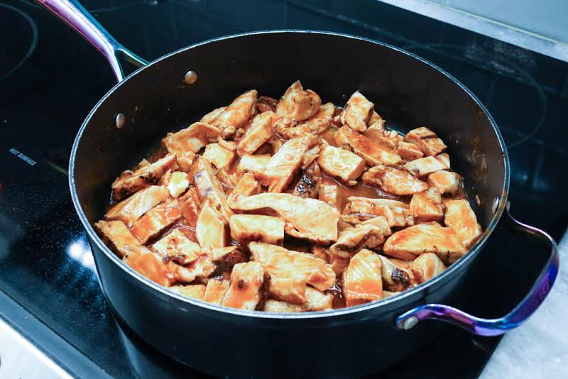 Chicken, Hot Sauce, Butter, Bbq Sauce, And Chili Powder In A Pan.