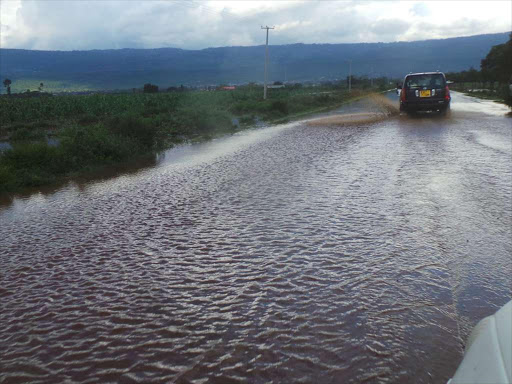 Floodwater cuts across the busy Narok-Mai Mahiu highway.