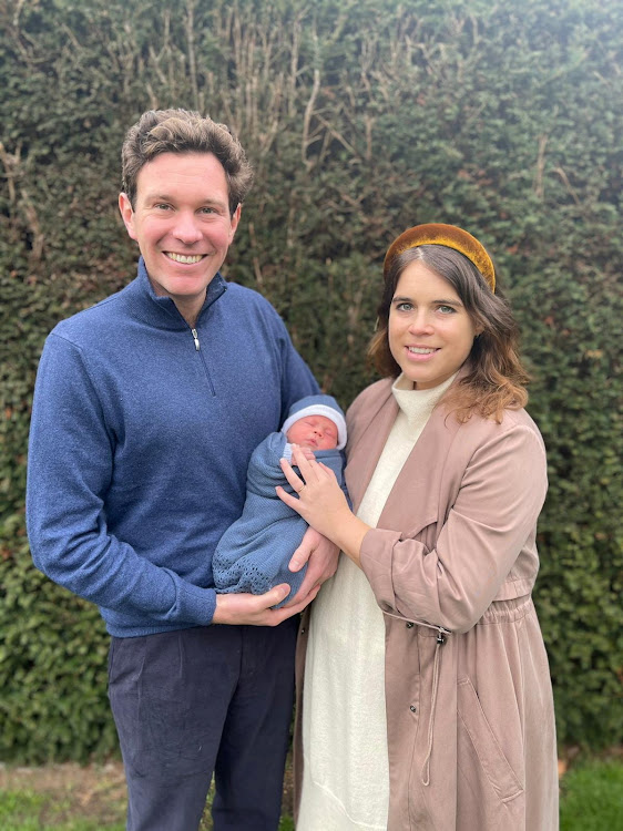 Britain's Princess Eugenie and husband, Jack Brooksbank, pose with their son in this undated handout photo issued by Buckingham Palace on February 20 2021.