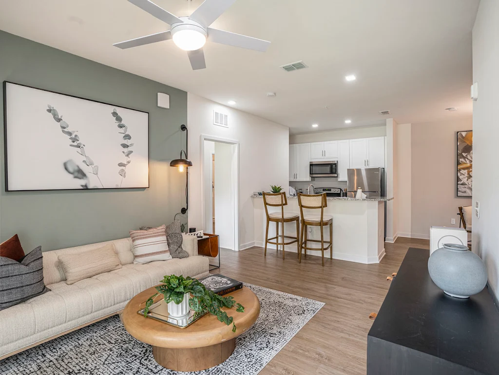 Model living room with furniture and open living areas