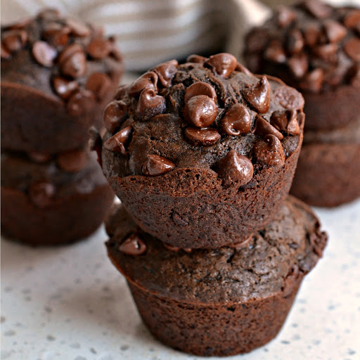 These moist rich delectable chocolate muffins full of semi sweet chocolate chips come together easily and quickly making them a family favorite.