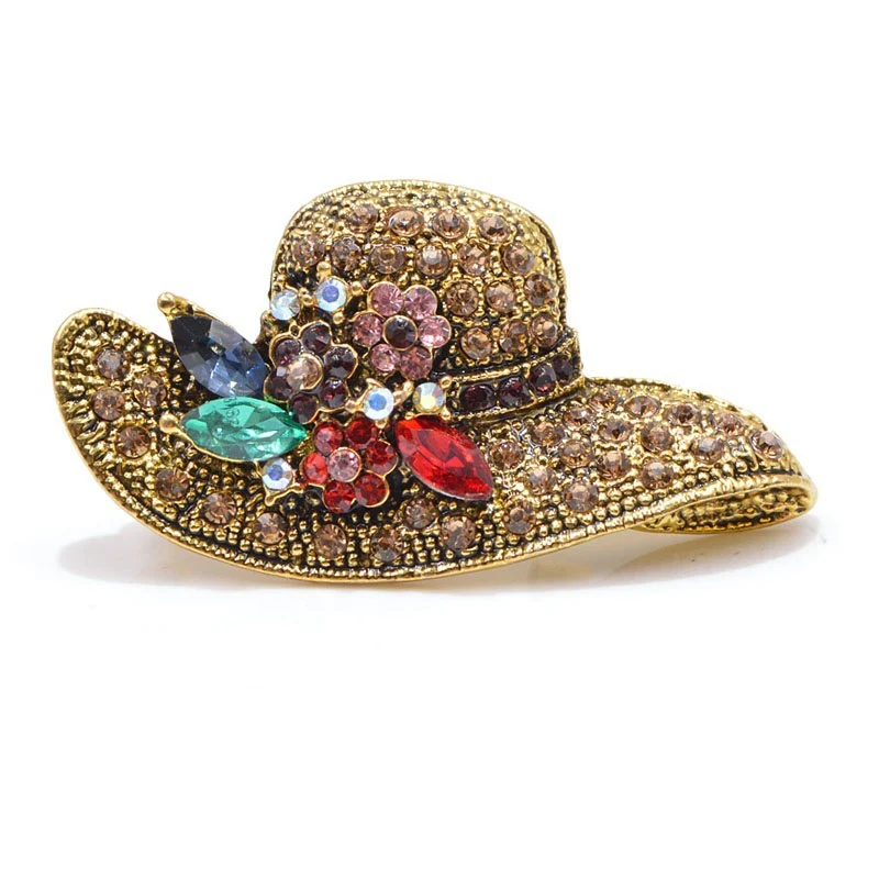 Antieke strohoed broche met diamantinleg Modieuze accessoire Tijdloze elegantie Verfraai je outfit met dit unieke sieraad Perfect voor liefhebbers van vintage