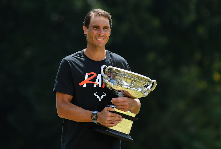 Spain's Rafael Nadal poses with the Norman Brookes Challenge Cup trophy after winning the Australian Open.