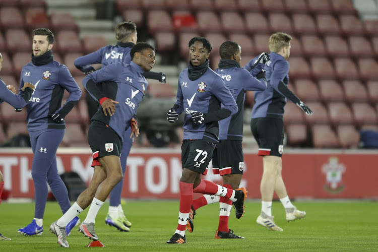 Kgaogelo Chauke (No.72) warms up with his Southampton teammates before a Premier League match against champions Liverpool at home at St Mary's on the south coast.