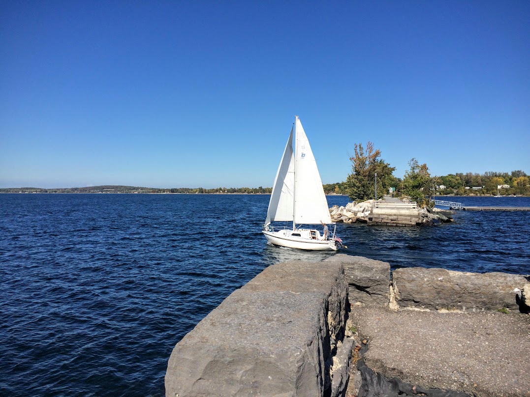 This is the only area in this part of the lake that allows boats to access east to west. The guy in this sail boat has done this a few times...the wind was really whipping, and he took the cut under full sail, and had time to through me a wave.