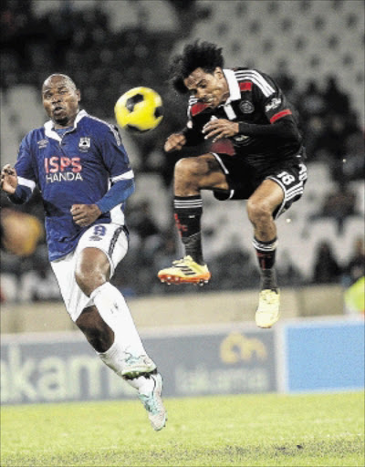 MISMATCH: Black Aces striker Collins Mbesuma, left, fights for the ball with Orlando Pirates midfielder Issa Sarr during their Absa Premiership match at Mbombela Stadium. Mbesuma opened the scoring with a free header in Aces' 2-1 win Photo: Veli Nhlapo