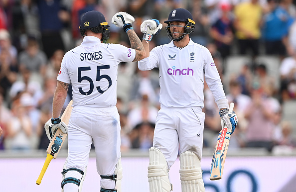 England batsman Ben Foakes is congratulated by Ben Stokes for reaching his half century during day two of the second test against South Africa at Old Trafford on August 26, 2022 in Manchester, England.