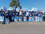 A DA demonstration outside Chatsworth's RK Khan hospital on Friday led by provincial chair Dean McPherson.
