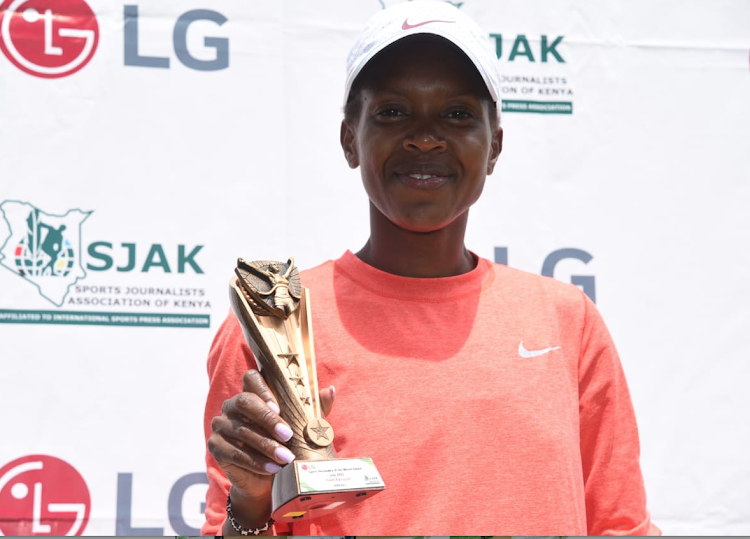 Faith Displays her trophy after winning LG/SJAK Sports Personality for the Month of July